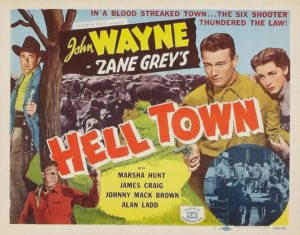 Lobby card for the movie Born to the West under the title Hell Town